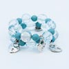 Bracelet perles bois bleues et cœurs argentés