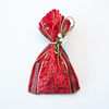 Pochon à bijoux rouge et or et lien doré